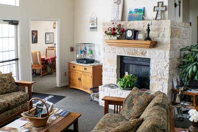 Interior common area with cozy seating and a fireplace