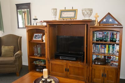 Cozy living room setup with a TV and bookshelves