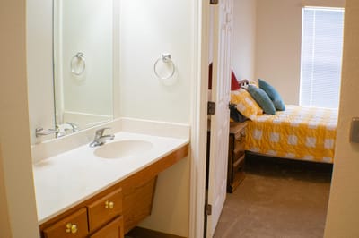 Private resident room with a bed and bathroom