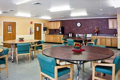 Common area with tables and kitchenette