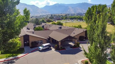 Aerial view of Rocky Mountain Care facility with mountains in the background