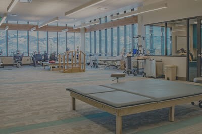 Spacious therapy room with large windows and mountain views