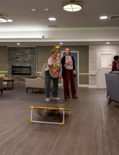 Residents participating in an indoor activity in a common area