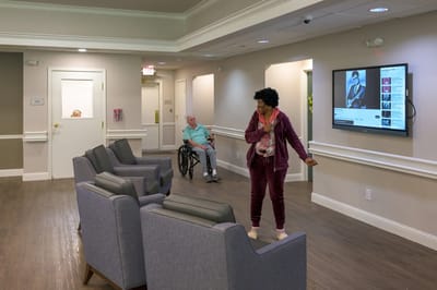 Residents and staff interacting in a common area
