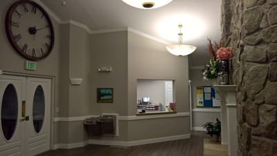 Interior view of a hallway with clock and decorations