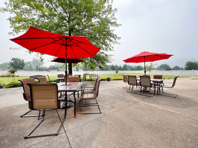 Outdoor seating area with red umbrellas