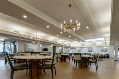 Interior view of a common dining area with tables and chairs