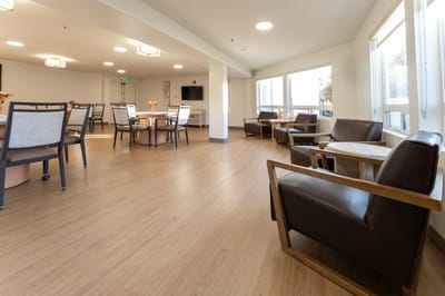 Bright common area with seating and tables