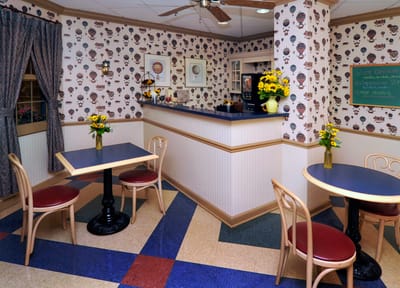 Bright activity room with colorful decor and tables