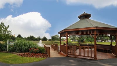 Gazebo in a landscaped outdoor area with flowers