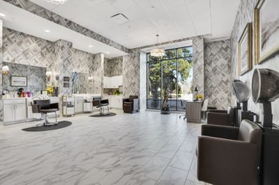 Bright and modern salon area with styling stations