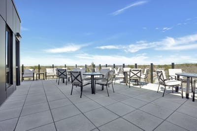 Outdoor patio area with tables and chairs