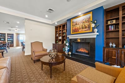 Comfortable common area with fireplace and shelves