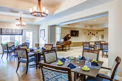 Bright dining room with tables set for meals