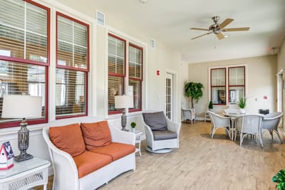 Bright common area with seating and windows