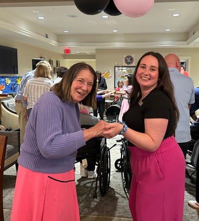 Residents and staff engaged in a joyful activity