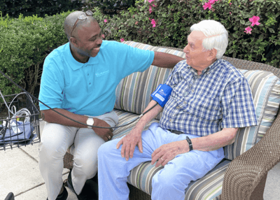 Staff member engaging with a resident outdoors