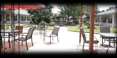 Outdoor patio area with seating and garden view