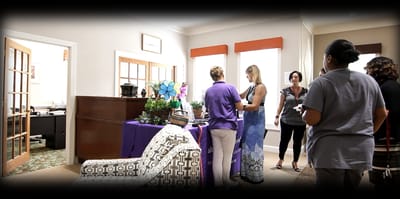 Residents and staff interacting in a community room