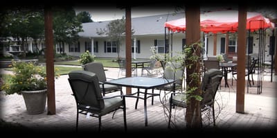 Outdoor seating area with tables and chairs