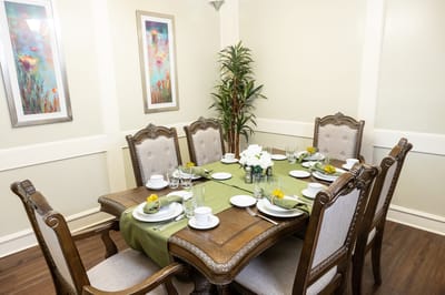 A beautifully set dining table with flowers and dishware