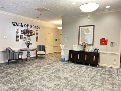 Bright lobby area with a Wall of Honor display