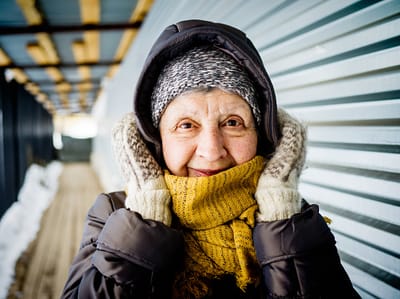 Senior woman smiling warmly in winter clothing