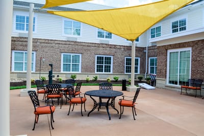 Outdoor seating area with tables and chairs