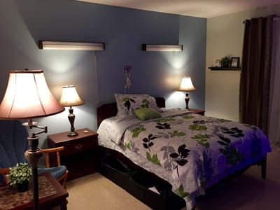 Cozy private resident room with bed and lamps