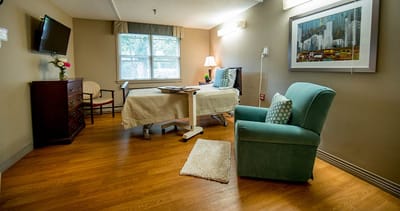 A well-furnished private resident room in the facility