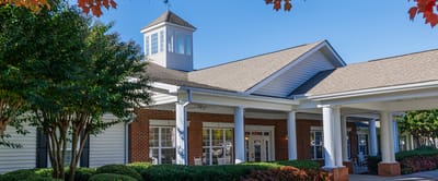 A bright view of the facility's exterior with landscaping