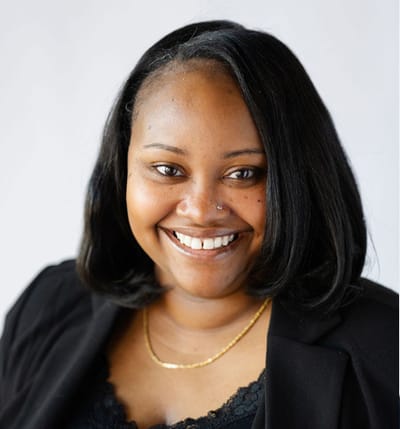 Smiling staff member in professional attire