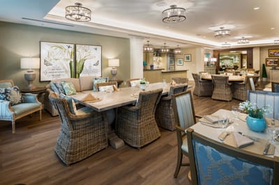 Elegant dining room with tables and wicker chairs