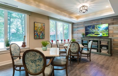 Bright common area with comfortable seating and windows