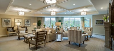Bright common area with comfortable seating and large windows