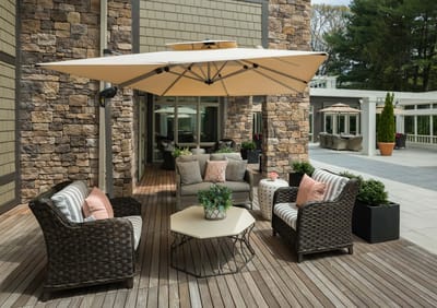 Cozy outdoor seating area with an umbrella and plants