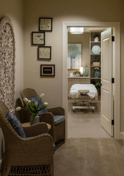 Interior massage room with treatment table and decor