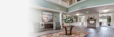 Bright lobby of an assisted living facility with floral decor