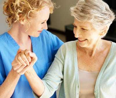 Caregiver interacting warmly with a resident