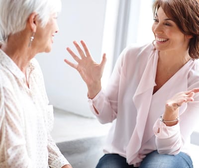 Two women engaged in a friendly conversation