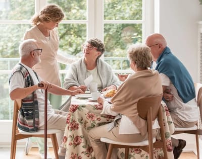 Residents enjoying a meal together in a cozy setting