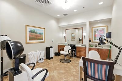 Hair salon area with styling chairs and equipment