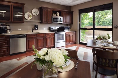 Bright interior of a kitchen area with dining tables
