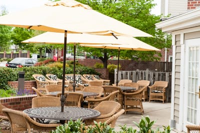 Outdoor seating area with umbrellas at the facility