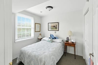 Cozy private bedroom with a bed and natural light