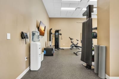 A fitness room with exercise equipment