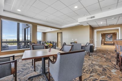 Bright common area with seating and flowers