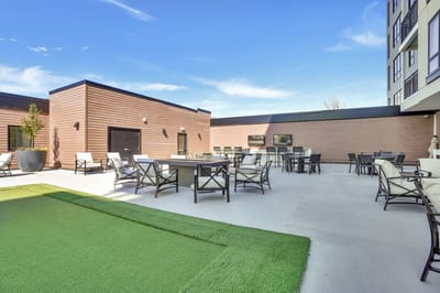 Outdoor seating area with tables and chairs