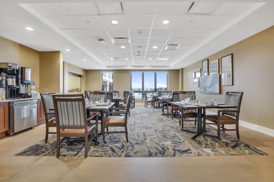 Interior view of a dining area with tables and chairs