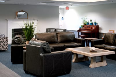 Common area with seating and piano